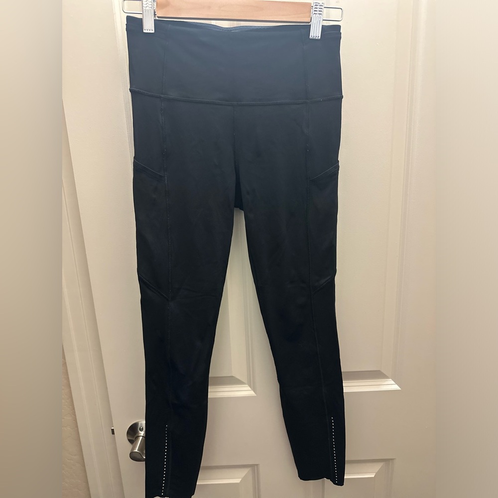 Black lululemon tights with pockets on the side.